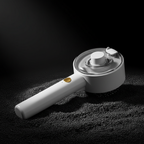 Pet grooming spray brush with dramatic lighting